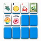 Beach mahjong tile faces beside blue tile backs: 1 Bam, 1 Dot, 1 Crak, Green dragon, Joker and Flower