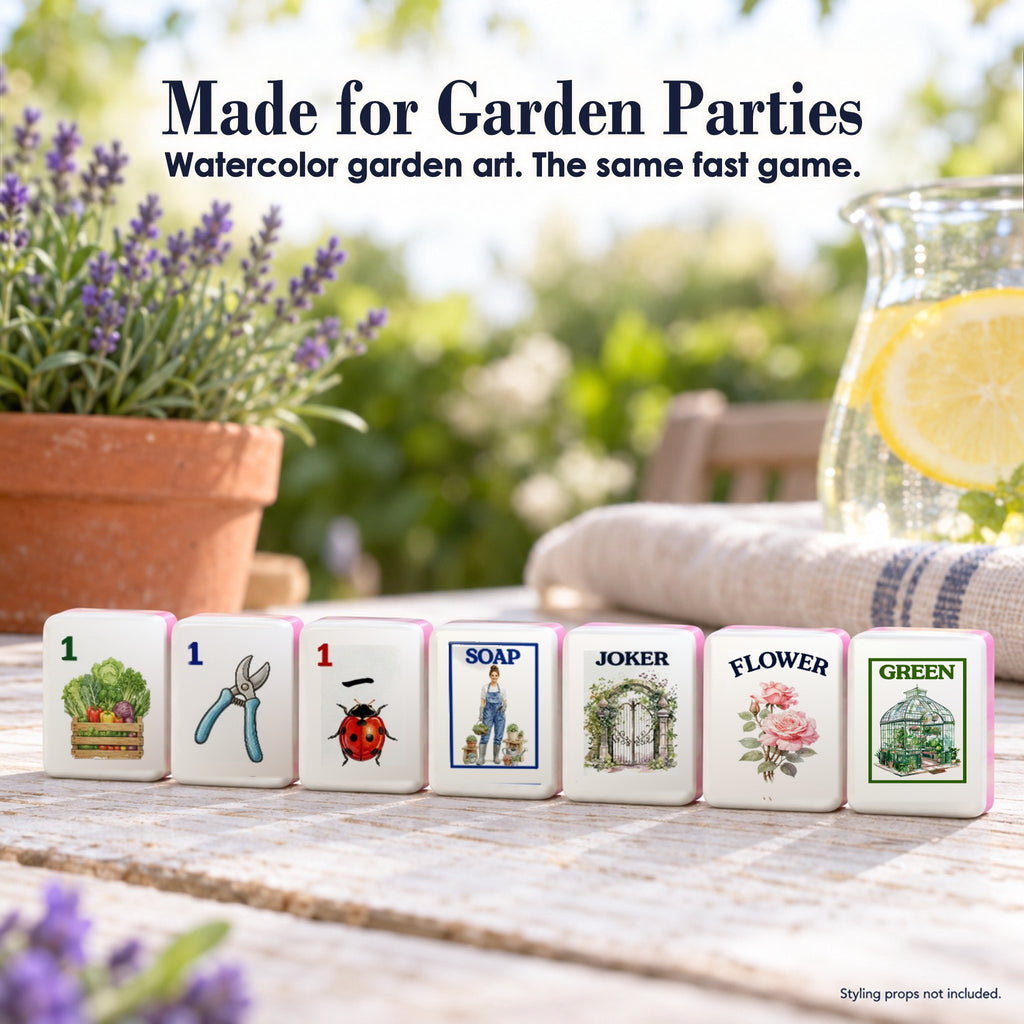 Seven Garden mahjong tiles on a sunny garden table with lavender: 1 Bam, 1 Dot, 1 Crak, SOAP, Joker, Flower and GREEN