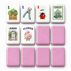 Garden mahjong tile faces beside pink tile backs: 1 Bam, 1 Dot, 1 Crak, Green dragon, Joker and Flower