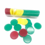 Loose green, red and yellow chips beside a tube