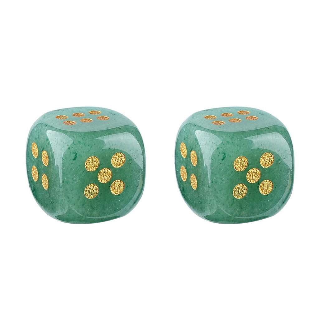 Two green stone dice with gold pips