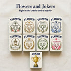 Eight different Flower tiles, each a tennis club crest with rackets, laurels or blooms, above one gold trophy Joker