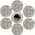 Round wooden coasters printed with mahjong tiles around a cup of coffee