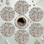 Mahjong tile print coasters spread on a table with a coffee cup