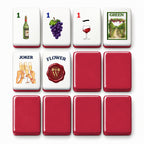 Wine mahjong tile faces beside deep red tile backs: 1 Bam, 1 Dot, 1 Crak, Green dragon, Joker and Flower